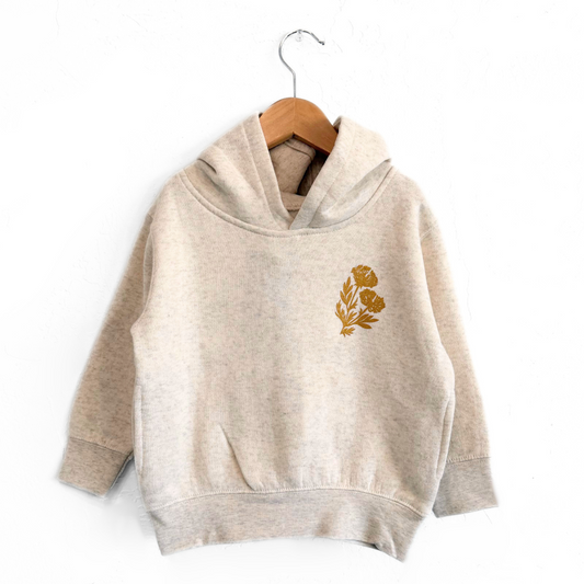 Beige hoodie with a gold floral design on a white background