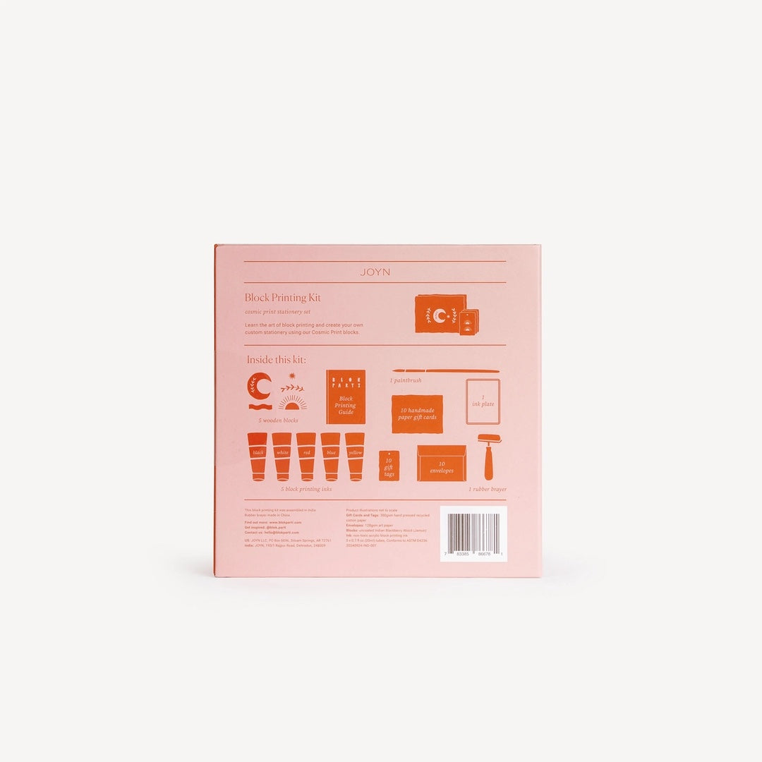 Pink packaging of a block printing kit with orange text and graphics on a white background
