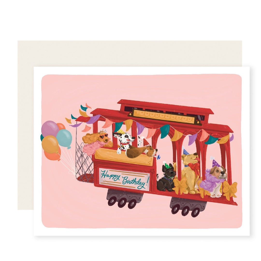 Greeting card with an illustration of a cable car with dogs. A sign on the cable car reads happy birthday!