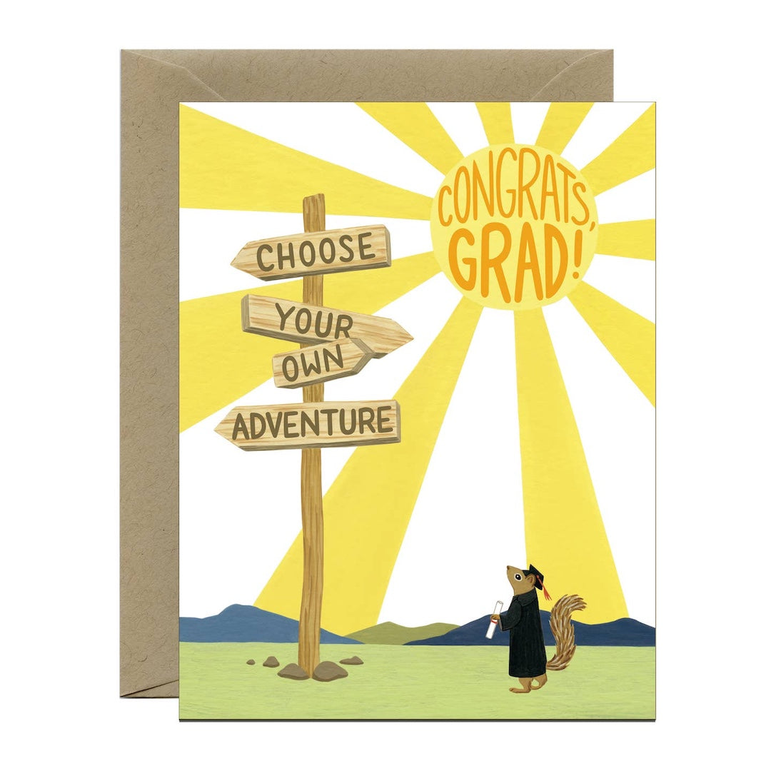 Graduation card with a squirrel in a graduation cap and gown, wooden signs that read 'choose your own adventure,' and sunburst background.