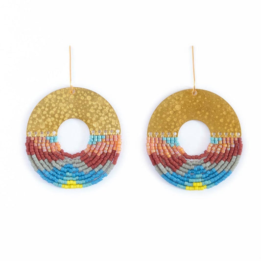 Colorful beaded earrings with blues, yellow, gray, and red on a white background