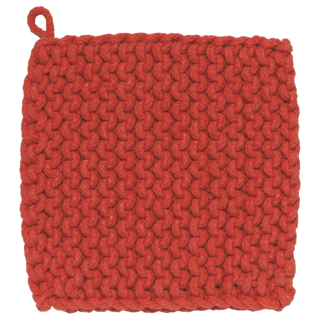 Red knitted pot holder on a white background