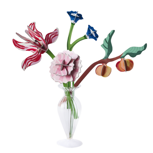 Colorful floral arrangement in glass vase on a white background