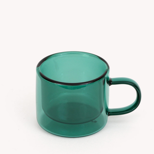green double walled espresso cup with handle on a white background