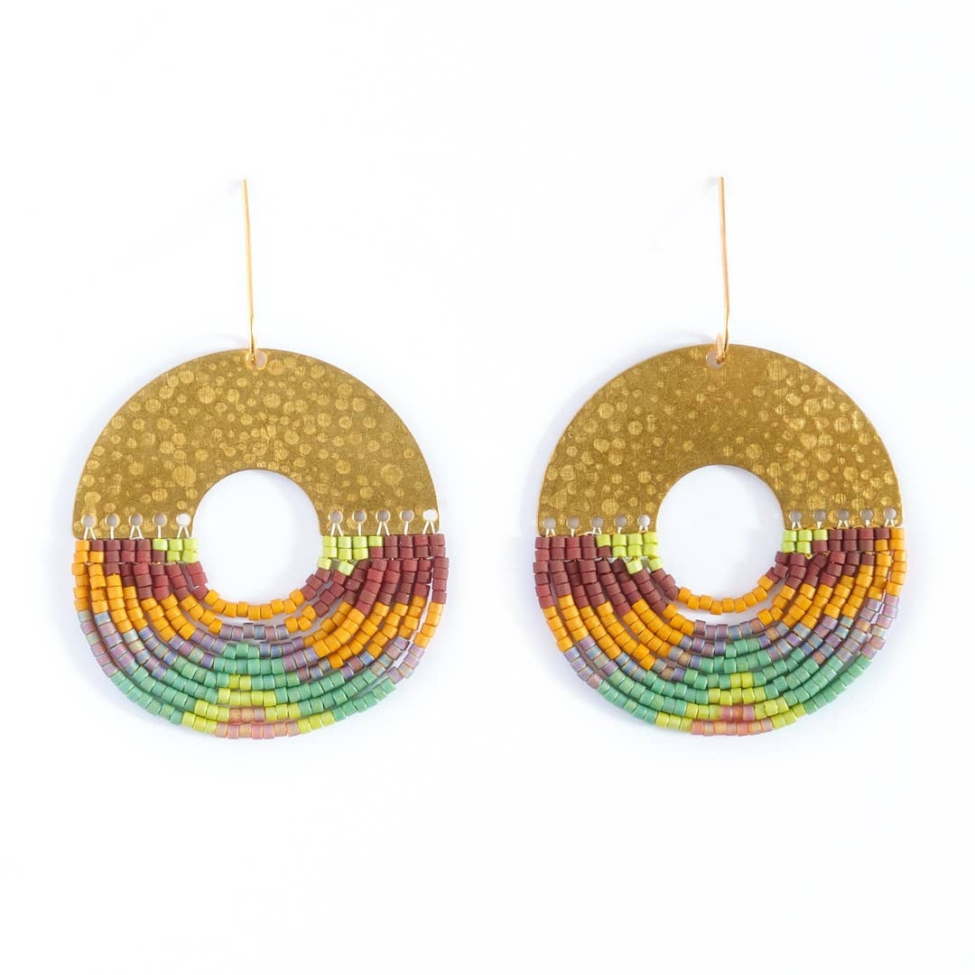 A pair of large circular gold-tone earrings with a textured top half and a lower half made of multiple curved rows of small multicolored beads in orange, yellow, green, purple, and red, shown on a plain white background.