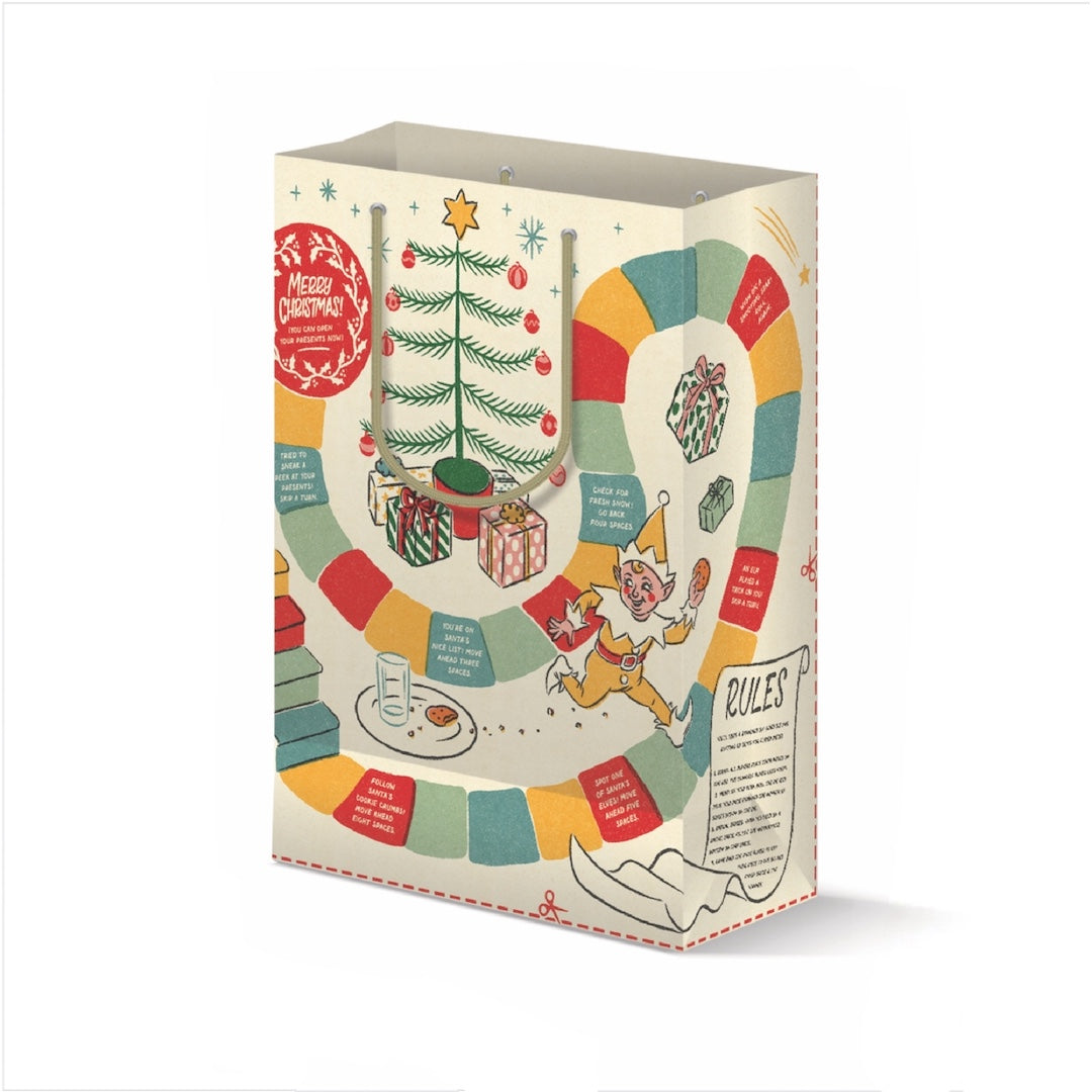 A Christmas-themed board game box shown on a clean white background. The packaging features festive illustrations including a decorated Christmas tree, wrapped gifts, a game board with colorful segments, a jester, and text sections titled 'Merry Christmas' and 'Rules'.
