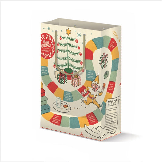 A Christmas-themed board game box shown on a clean white background. The packaging features festive illustrations including a decorated Christmas tree, wrapped gifts, a game board with colorful segments, a jester, and text sections titled 'Merry Christmas' and 'Rules'.