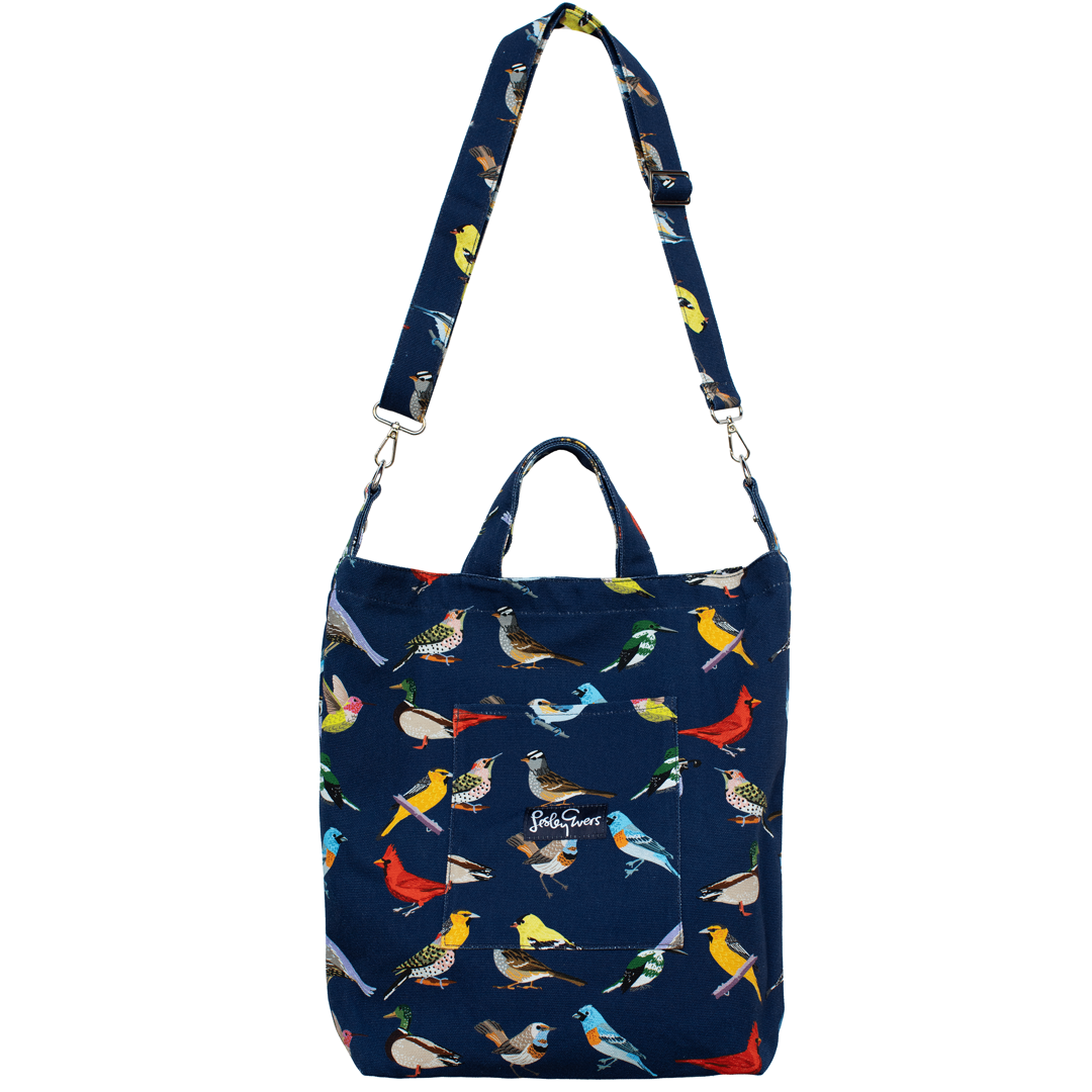 Navy blue bag with colorful bird pattern on a white background