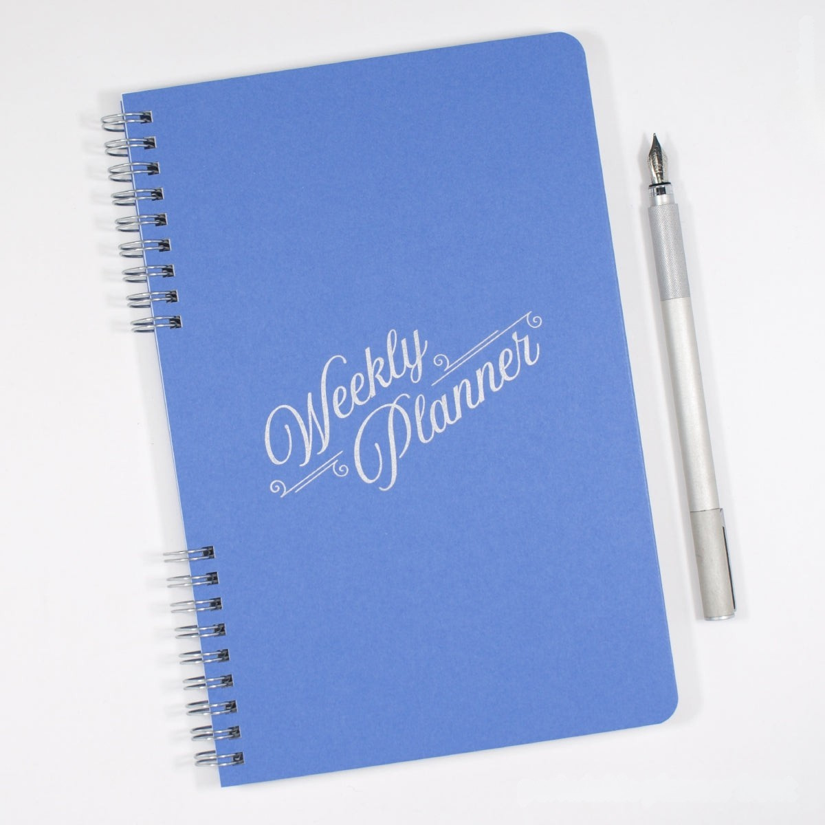 Blue weekly planner with a pen on a white background