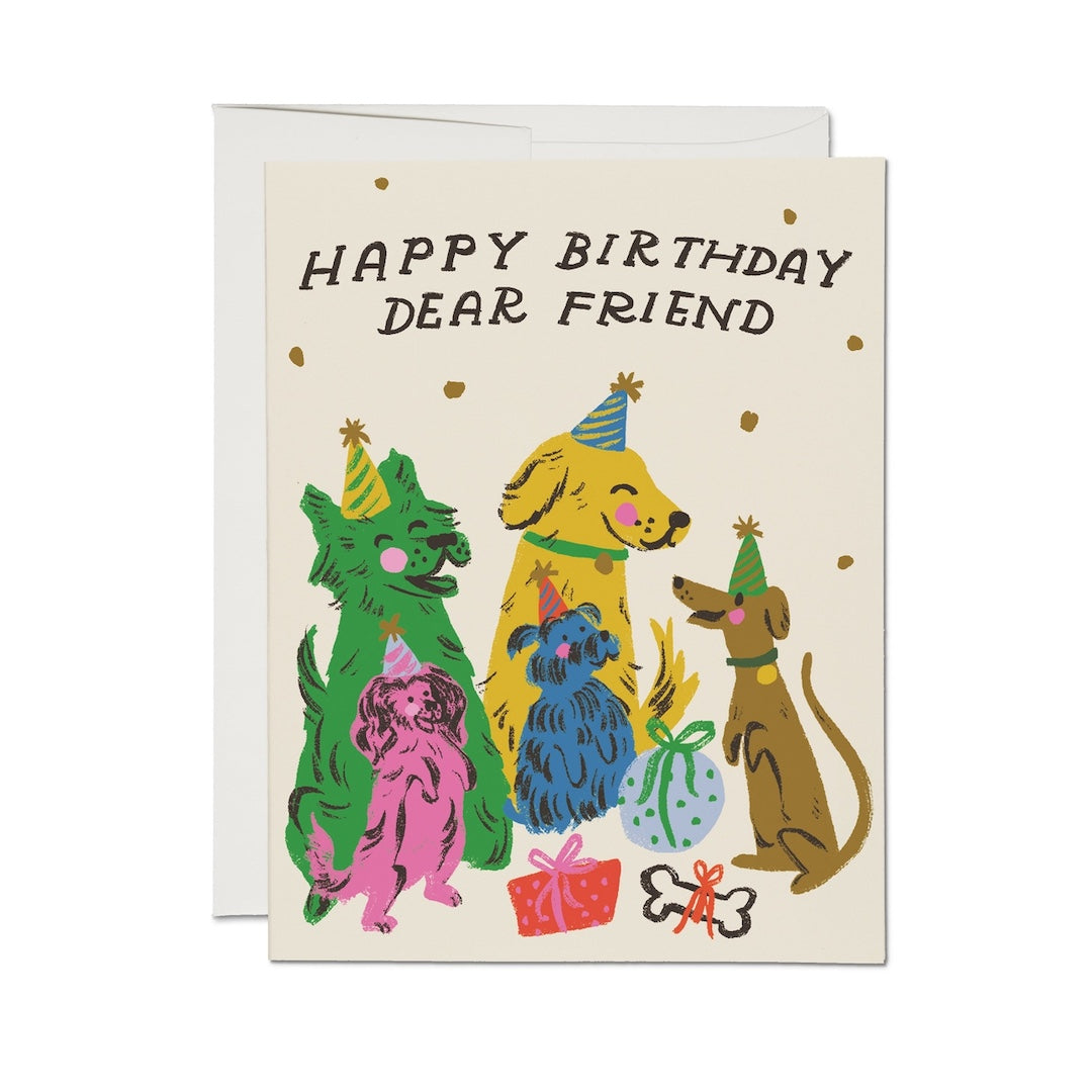 Birthday card with colorful illustrations of dogs wearing party hats on a beige background. Text on card says "happy birthday dear friend"