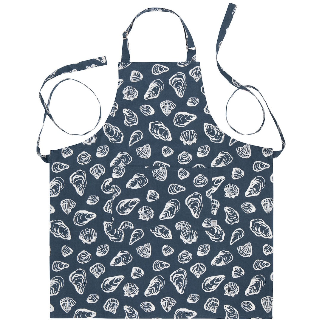 Navy apron with white shell pattern on a white background