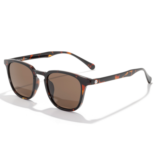 Sunglasses with tortoiseshell frame and brown lenses on a white background