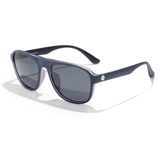 A pair of matte navy blue aviator-style sunglasses with dark gray lenses, shown at a three-quarter angle on a clean white background.