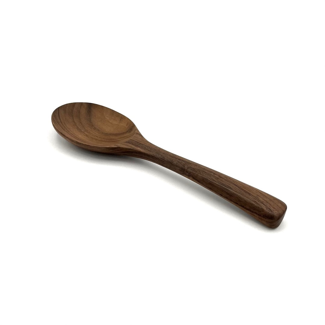 Wooden spoon on a white background