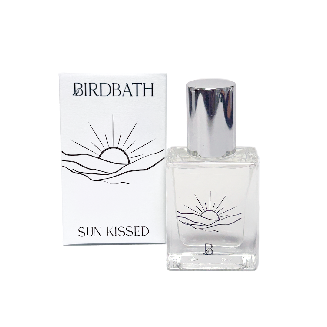 Birdbath Sun Kissed perfume bottle and packaging on a white background