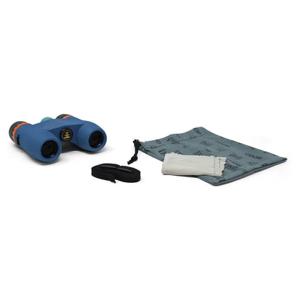 Blue binoculars with strap and cleaning cloth on a white background