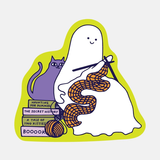 sticker of a ghost with a cat, books, and yarn on a white background