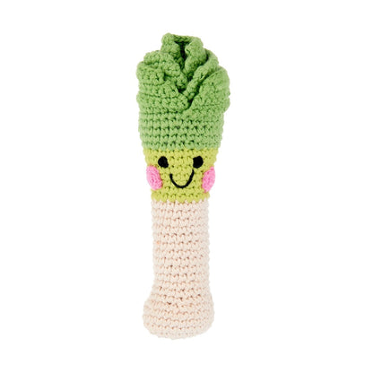 Crocheted leek rattle with a smiley face on a white background