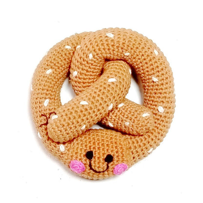 Crocheted pretzel rattle on a white background