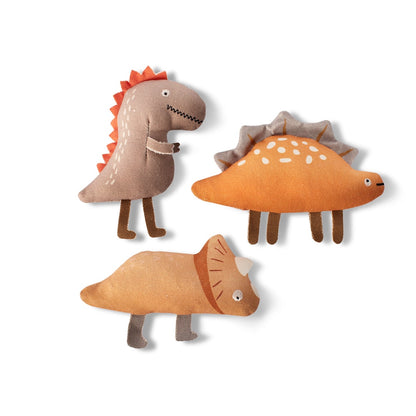 Three dinosaur-shaped toys on a white background