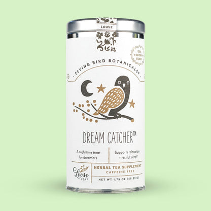 Tea canister labeled 'Dream Catcher' by Flying Bird Botanicals on a light green background