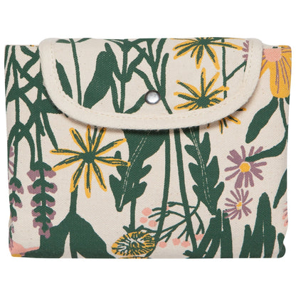 Floral patterned fold up tote that's been folded up and buttoned shut on a white background