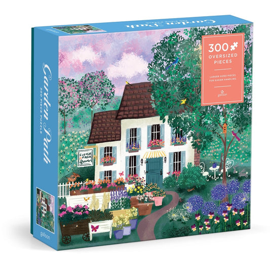 Jigsaw puzzle box with a colorful illustration of a garden house scene, featuring oversized pieces.