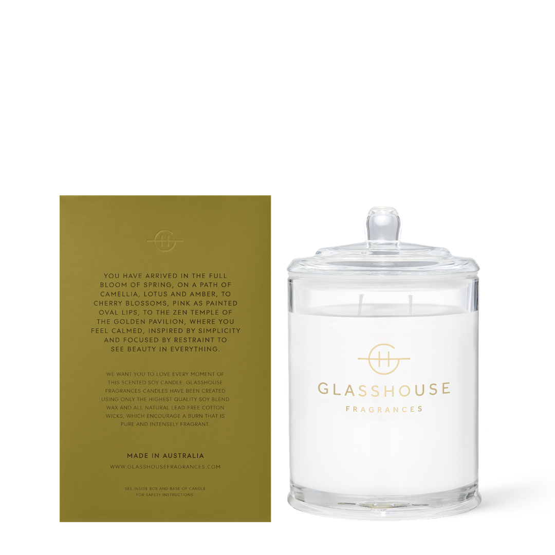 Glasshouse Fragrances candle with a green label on a white background