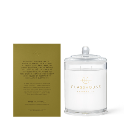 Glasshouse Fragrances candle with a green label on a white background