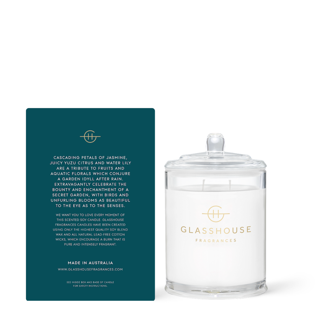 Glasshouse Fragrances candle with its packaging on a white background