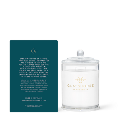 Glasshouse Fragrances candle with its packaging on a white background