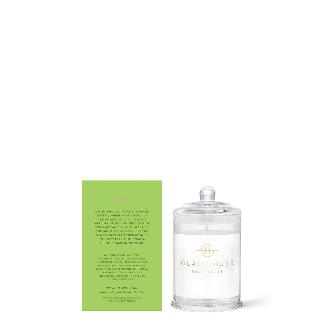Glasshouse candle with its green box on a white background