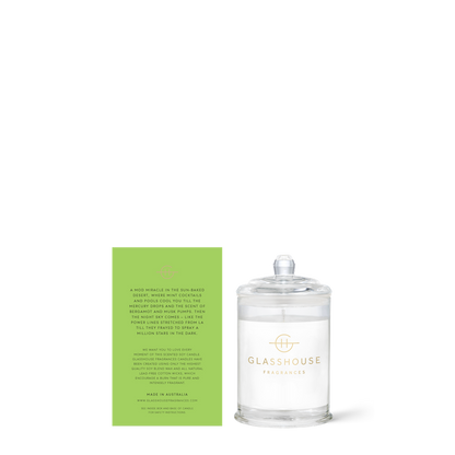 Glasshouse candle with its green box on a white background