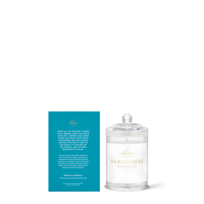 Glasshouse Fragrances candle with its blue box on a white background