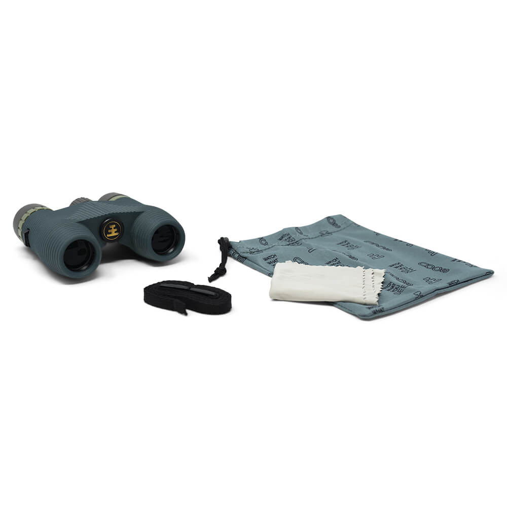 Binoculars with carrying strap and cloth on a white background