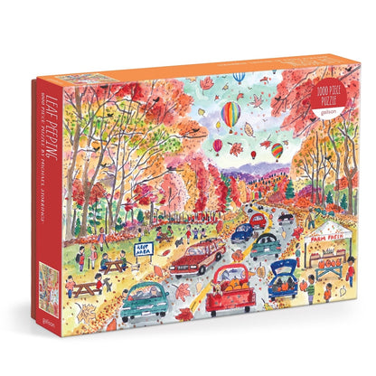 Colorful puzzle box with an autumn-themed design featuring trees, people, and cars.