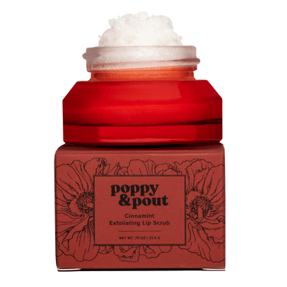 Red jar of 'Poppy & Pout' cinnamint lip scrub on a white background