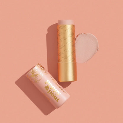 Poppy & Pout Farrah lip tint in a gold tube on a pink background