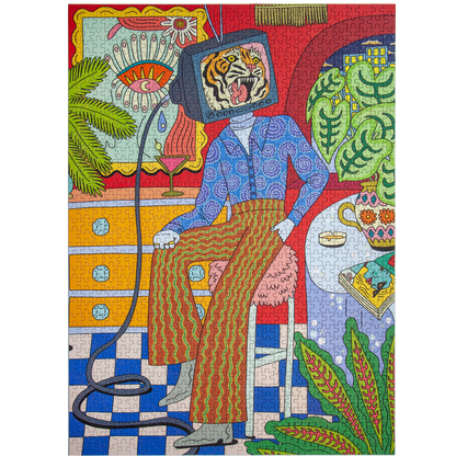 A colorful jigsaw puzzle featuring a surreal illustration of a seated person with a television head showing a tiger, surrounded by plants, furniture, and patterned details in bright red, blue, green, yellow, and orange tones.