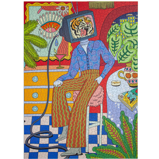 A colorful jigsaw puzzle featuring a surreal illustration of a seated person with a television head showing a tiger, surrounded by plants, furniture, and patterned details in bright red, blue, green, yellow, and orange tones.