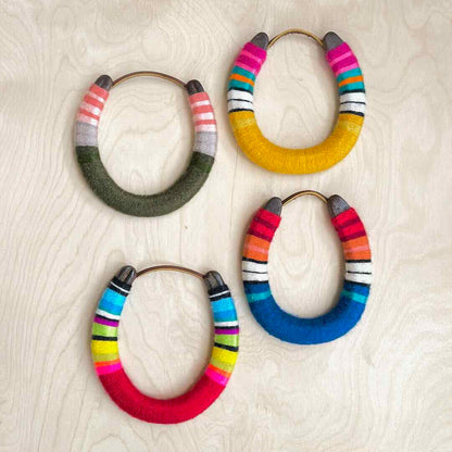 Set of colorful yarn wrapped horseshoes.