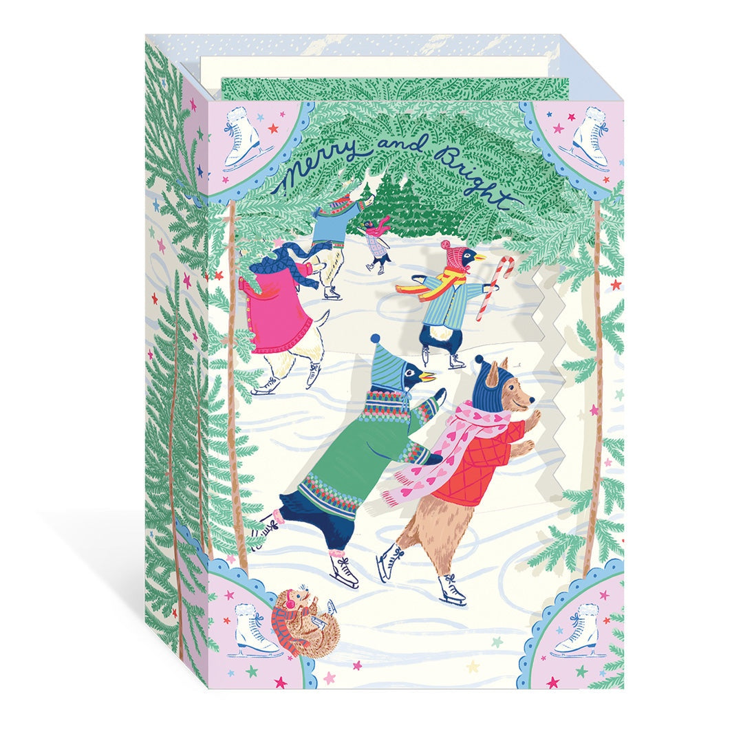 3D layered card with winter-themed design of animals skating and skiing, featuring 'Merry and Bright' text.