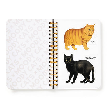 Sticker book with cat-themed stickers on a white background