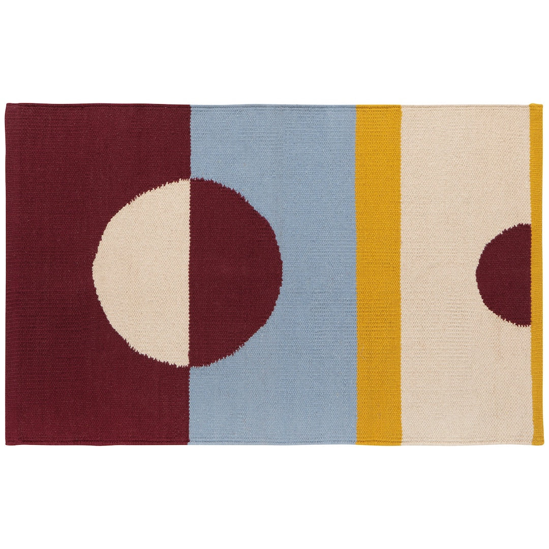 Multicolored rug with geometric patterns on a white background