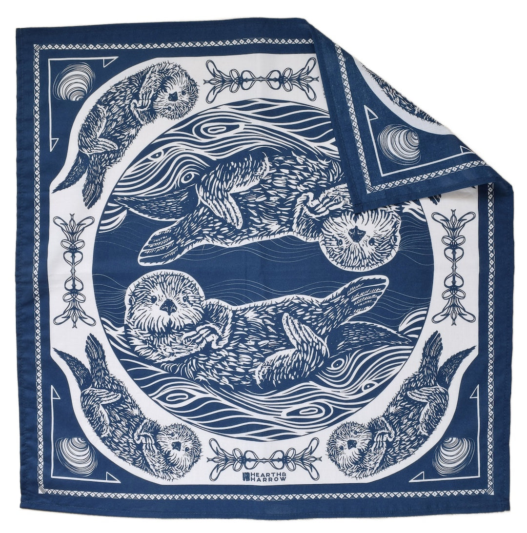 Navy blue and white bandana with otter design on a white background
