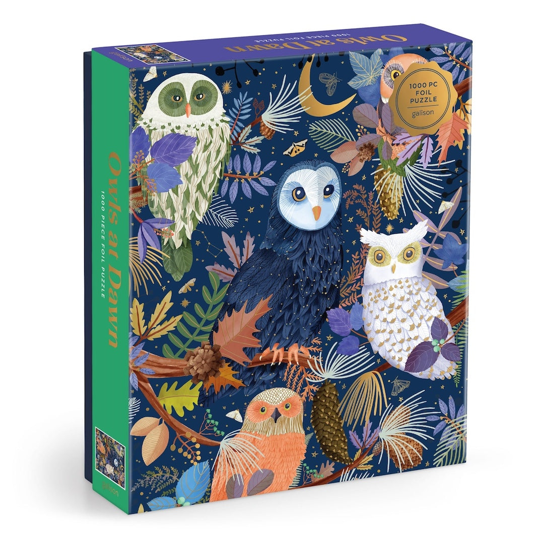 Jigsaw puzzle box with owl illustrations on a white background