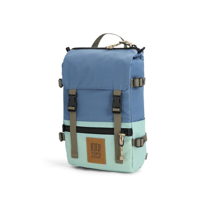Two-tone blue and light green backpack with Topo Designs logo on a white background