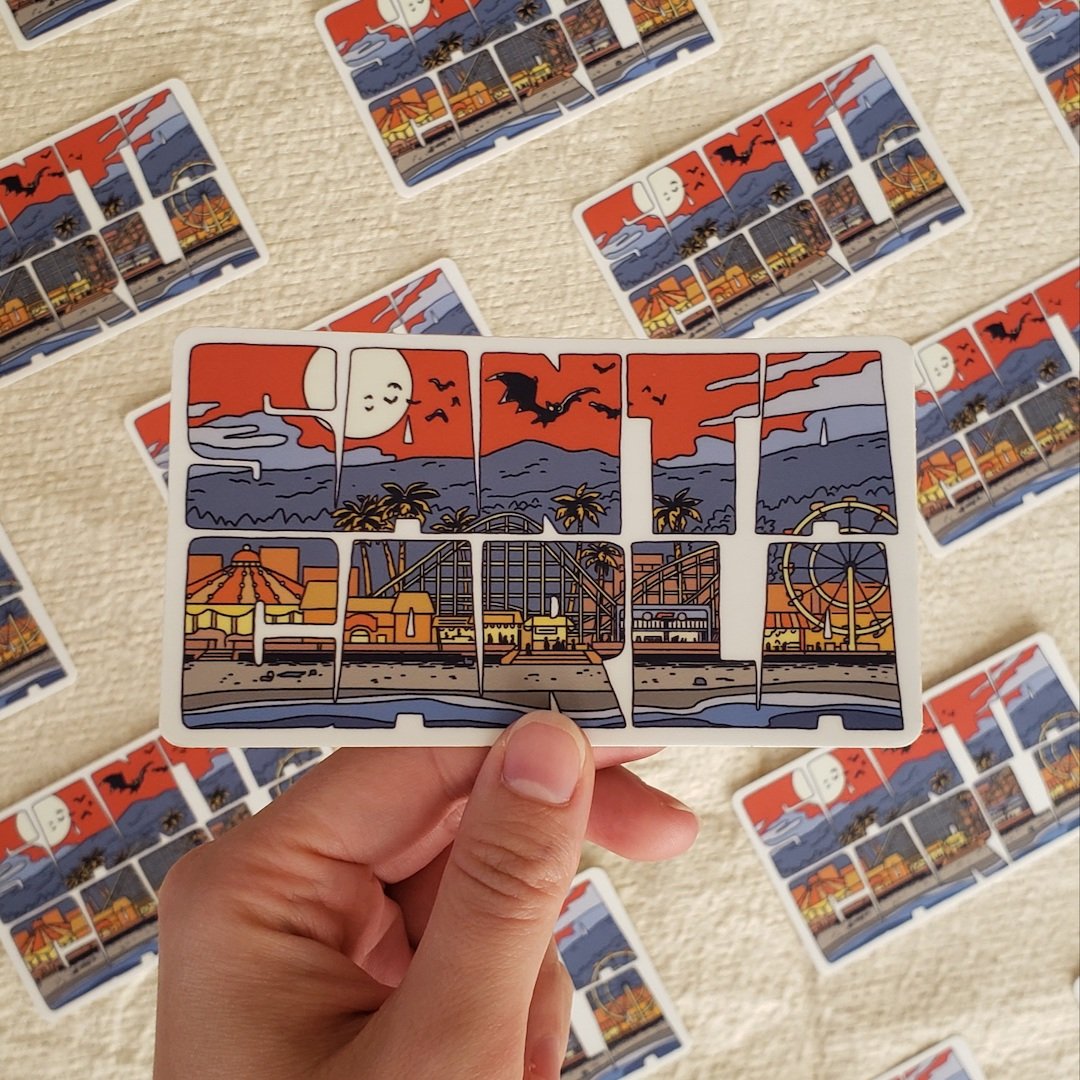 Santa Carla sticker that shows the boardwalk and bats from the move the lost boys