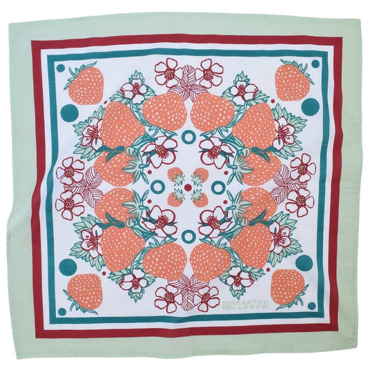 Square bandana with strawberry pattern on a light green background