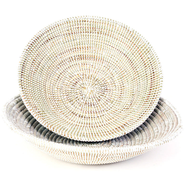 Stack of woven baskets on a white background